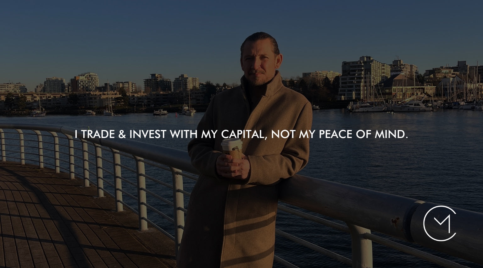 A man stands by the Vancouver waterfront holding a coffee, illustrating position sizing, trading risk and protecting peace of mind.